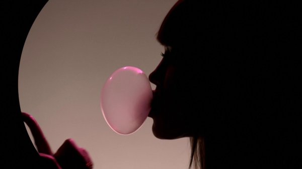 blowing bubble gum